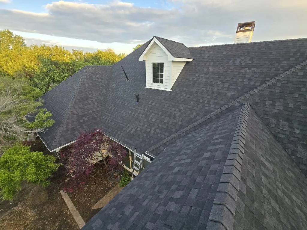 Close view of shingles and a dormer on a Lee Construction roofing project